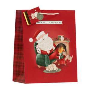 Add a touch of warmth and whimsy to your Christmas offerings with our Medium Sleepy Santa Gift Bag. This delightful bag showcases a charming illustration of Santa Claus enjoying a well-deserved nap in his armchair by a cozy fireplace, with two adorable dogs keeping him company. The classic "Merry Christmas" message sets the festive tone, complemented by stylish red plaid side panels that add a traditional touch. Designed for convenience and care, it features sturdy rope handles and an eco-friendly tag, making it a thoughtful choice for any gift. Supplied by Partisan Products Ltd, each wholesale pack contains 6 of these enchanting bags, ensuring your customers can share the joy of the season with ease and style.