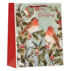 Make your Christmas gifts truly special with our delightful Large Snowy Robins Gift Bag. This charming bag features a beautiful illustration of two friendly robins nestled among snow-dusted holly and vibrant red berries, evoking a classic winter scene. The elegant 'Merry Christmas' message in festive red script adds a warm touch, complemented by the rich red sides and sturdy rope handle. Perfect for presenting a variety of gifts, this bag also proudly carries an eco-friendly and recyclable tag, offering a thoughtful choice for the holidays. Stock up with our convenient pack of 6 to ensure your customers have the perfect festive packaging.