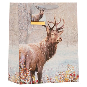 Present your gifts in style this winter with our stunning Large Winter Stag Gift Bag! This beautiful bag features a majestic stag, adorned with a dusting of snow, set against a serene, snow-covered forest backdrop. The elegant design is complemented by a charming gift tag, also showcasing the magnificent stag, and a luxurious ribbon handle. Perfect for Christmas, birthdays, or any special occasion during the colder months, this large bag is ideal for holding a variety of thoughtful presents. Add a touch of natural beauty and festive cheer to your gift-giving.