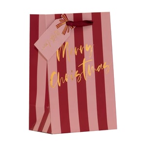 Brighten your festive offerings with our charming Small Pink Stripe Gift Bag. This delightful bag features a stylish design of alternating pink and red stripes, beautifully complemented by shimmering gold foil lettering that reads "Merry Christmas". A matching gift tag, tied with a rich burgundy ribbon, adds a thoughtful touch, making it ready for any special present.
Perfect for boutiques and gift shops, these bags are ideal for customers seeking an elegant and convenient way to present their Christmas gifts. Available in a handy pack of 6, ensuring you're well-stocked for the holiday season. Supplied by Partisan Products Ltd.