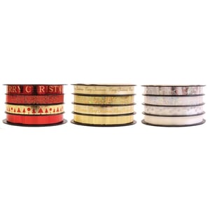 three rolls of merry christmas ribbon are stacked on top of each other
