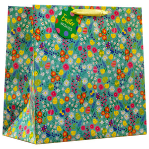 Get ready for a delightful Easter with our Medium Easter Ditsy Gift Bag! Perfect for presenting those special seasonal treats and gifts, this charming bag features a vibrant ditsy floral pattern on a fresh teal background. Adorned with cheerful yellow chicks, colourful decorated eggs, and an array of pretty spring flowers, it beautifully captures the joyful spirit of Easter. Each bag comes complete with a sweet 'Easter Wishes' tag and bright yellow ribbon handles, adding a lovely finishing touch. Supplied by Partisan Products Ltd., these medium-sized bags are available in a convenient pack of 6, making them an ideal choice for retailers looking to stock up on festive packaging. Make every gift extra special this Easter!