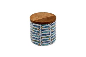 Bring a touch of coastal charm to any home with our delightful 10cm Wooden Sardines Enamelled Jar. This charming jar features a vibrant pattern of blue and yellow sardines, beautifully set against a crisp white enamelled finish.
Topped with a natural wooden lid, it offers both style and practicality, keeping contents fresh and secure. Perfect for storing kitchen essentials like salt, sugar, or spices, it's equally at home in the bathroom for cotton pads or as a decorative piece. Its compact 10cm size makes it a versatile addition to any countertop or shelf, adding a splash of Mediterranean flair. A lovely gift idea or a stylish treat for yourself, this jar is sure to brighten any space.