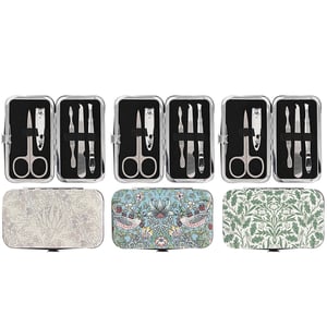 Introduce your customers to timeless elegance with our William Morris Manicure Set 3 Asst, proudly supplied by Lesser and Pavey Ltd. Each exquisite set features a compact, hard-shell case adorned with iconic William Morris patterns – a beautiful cream floral, a charming blue 'Strawberry Thief' bird design, and a lush green foliage print.
Inside, discover a comprehensive collection of high-quality stainless steel tools, including nail clippers, scissors, tweezers, and cuticle tools, all neatly secured for convenience. Perfect for on-the-go touch-ups or a luxurious home pamper, these sets make an ideal gift or a delightful personal treat. Stock up with our convenient 1x12 pack size and offer your customers a blend of classic design and everyday practicality.