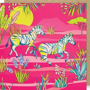 Bring a vibrant splash of the tropics to your card selection with this stunning 'Blank Female' card from Paper Rose. Featuring two beautifully illustrated zebras, their unique blue, yellow, and white stripes pop against a vivid hot pink landscape. Lush tropical foliage and a bright yellow sun complete this energetic and exotic scene.
Perfect for birthdays, thank yous, or just to say hello, this versatile card is left blank inside for a truly personal message. Its cheerful design is sure to delight any recipient. Available in a convenient pack of 6, it's a fantastic addition for retailers looking to offer something truly eye-catching and memorable.