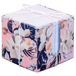 Add a touch of elegance to any desk with the stunning Zara Memo Block. This beautiful memo block features a captivating floral design, showcasing delicate cream and peach flowers nestled amongst lush navy foliage, all set against a soft pink background. It's the perfect blend of functionality and sophisticated style.

Ideal for jotting down notes, reminders, or your latest brilliant ideas, its compact cube shape makes it a practical addition to any workspace or home. The handy white elastic band keeps your pages neat and tidy, adding a charming finish. Supplied by Partisan Products Ltd, each Zara Memo Block is available as a single unit, ready to bring a burst of beauty to your customers' everyday tasks.