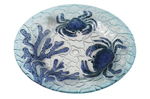 Bring a touch of coastal charm to your customers' homes with our delightful 30.5cm Crab Glass Plate. This beautifully crafted plate features an enchanting underwater scene, showcasing two vibrant blue crabs alongside intricate coral designs. The clear, textured glass mimics gentle ocean waves, adding a serene and elegant feel to any setting.
Perfect for serving appetisers, displaying decorative items, or simply as a stunning centrepiece, this versatile plate is sure to capture attention. Its generous 30.5cm diameter offers ample space. Each wholesale pack contains three of these exquisite plates, making them an ideal addition to your homeware or giftware collection. Offer your customers a piece of the seaside with this unique and eye-catching design.