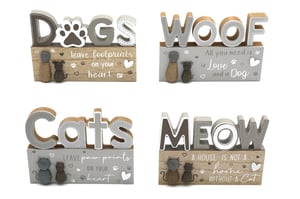 Celebrate the special bond with pets with our delightful 14x11cm Wooden Blocks! Perfect for any animal lover, these charming decorations feature heartwarming messages for both dog and cat enthusiasts. Choose from four adorable designs: "DOGS leave footprints on your heart," "WOOF All you need is Love and a Dog," "Cats LEAVE paw prints ON YOUR heart," and "MEOW A HOUSE IS NOT A home WITHOUT A Cat." Crafted from wood with a rustic finish and neutral grey and brown tones, they add a touch of warmth to any home. Each block measures 14x11cm, making them ideal for shelves, desks, or mantelpieces. Collect all four to create a wonderful display, or pick your favourite as a thoughtful gift for a fellow pet parent.