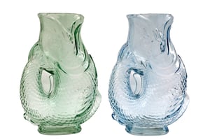 Introduce a touch of aquatic elegance to your collection with our charming 30cm Soleil Fish Glass Vase. These unique vases, available in delightful green and serene blue, are exquisitely crafted to resemble graceful fish, complete with intricate scale textures and flowing fin details. Made from beautiful translucent glass, they beautifully catch and reflect light, adding a vibrant and captivating accent to any room.
Perfect for showcasing a fresh bouquet or simply as a standalone decorative piece, these fish-shaped vases are sure to enchant your customers. Supplied by Sifcon International PLC, each vase is packaged individually, making them an ideal and distinctive offering for your retail space.