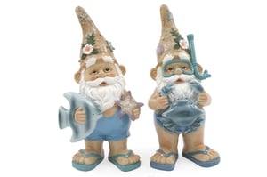 Bring a splash of seaside charm to any home or garden with these delightful 27cm Ocean Gnomes. This charming duo features two unique designs, perfect for adding a touch of summer fun. One gnome is ready for a day at the beach, holding a fish and a starfish, while his companion is geared up for underwater adventures with a snorkel mask and a friendly crab.
Each gnome is beautifully detailed, from their sandy-toned hats adorned with shells and flowers to their cute flip-flops. Supplied as a pack of two, these cheerful characters are ideal for brightening up patios, conservatories, or indoor displays. They're sure to bring smiles and a touch of coastal whimsy wherever they go.