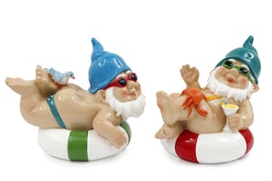 Dive into summer sales with our adorable 14cm Ocean Gnome Swim Ring duo! Supplied by Sifcon International PLC, these charming gnomes are perfectly poised to bring a touch of whimsical seaside fun to any setting. Each pack contains two assorted designs (1x2), ensuring variety and delight for your customers.
Meet our first gnome, soaking up the sun in a blue hat and red shades, complete with a little bird companion on his back and a green-striped swim ring. His cheerful counterpart sports a teal hat, green sunglasses, and a crab friend, all while sipping a refreshing cocktail on a red-striped float. These delightful characters are ideal for brightening up gardens, patios, or even indoor displays, making them a fantastic impulse buy. Get ready to spread some holiday cheer!