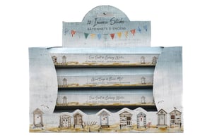 Bring the serene beauty of the seaside into any home with our charming 4 Pack Variety Incense Sticks. This delightful collection features a coastal scene design, complete with quaint beach huts and a weathered wood effect, making it a lovely decorative item as well as a source of beautiful aromas.
Each display box contains four individual packs, with 10 incense sticks in each. Discover two wonderfully refreshing scents: 'Sea Salt & Calming Waters' and 'Wood Sage & Ocean Mist'. Perfect for creating a relaxing atmosphere, these incense sticks are ideal for unwinding after a long day or simply adding a touch of coastal calm to any space. A fantastic gift or a treat for yourself!