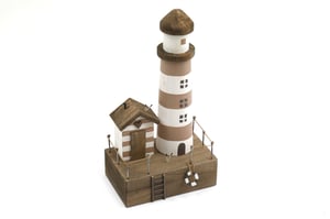 Bring a touch of seaside charm to any home with this delightful decorative lighthouse. Standing at 33.5cm tall with a 15.5cm base, this beautifully crafted wooden ornament captures the essence of coastal living. The lighthouse features classic white and natural striped detailing, complete with charming windows and a rustic brown top.
Nestled beside it is a quaint beach hut, adorned with a sweet heart motif above the door, and a small ladder leading up to the sturdy wooden base. A miniature lifebuoy adds an extra nautical touch, making this piece truly special. Perfect for adding a serene, beachy vibe to shelves, mantels, or desks, it's an ideal gift for ocean lovers or anyone looking to infuse their space with a calming, maritime feel.