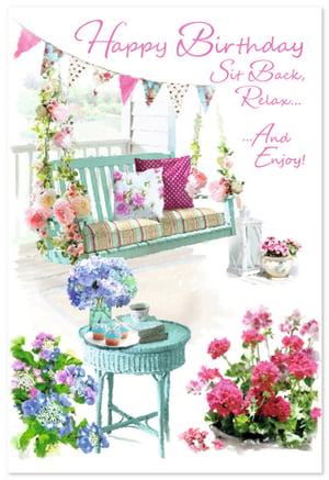 Invite recipients to 'Sit Back, Relax... And Enjoy!' their special day with this beautiful Open Birthday Female card from Simon Elvin. This charming design features a serene porch swing, adorned with delicate floral garlands and cosy cushions, set against a tranquil garden backdrop. A quaint side table holds a vase of vibrant hydrangeas, a cup of tea, and delicious cupcakes, creating an atmosphere of peaceful celebration. With its soft watercolour style, pretty pinks, and calming teal accents, this card offers a truly lovely way to send birthday wishes. Perfect for any female, it comes in a convenient pack of 6.