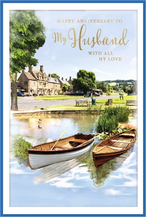 Offer your customers the perfect way to celebrate their love with our Husband Wedding Anniversary card from Simon Elvin. This exquisite card features a truly charming and tranquil scene, depicting a picturesque village green with traditional stone cottages and serene waters where two wooden boats gently rest. The idyllic setting is beautifully complemented by the heartfelt message, 'Happy Anniversary to My Husband With All My Love,' elegantly presented in gold script. This card is designed to convey deep affection and cherished memories, making it an ideal choice for any wife looking to express her devotion. Supplied in a convenient pack of 6, it's a wonderful addition to your anniversary card selection.