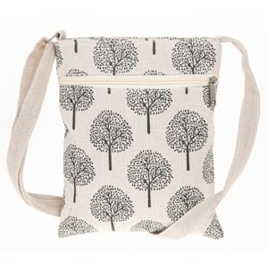 Introduce your customers to the delightful Tree Of Life Cross Body Bag in Cream, a charming accessory that blends style with everyday practicality. This lovely bag features a striking 'Tree of Life' motif, beautifully printed in black against a natural cream-coloured fabric, offering a touch of nature-inspired elegance.
Designed for convenience, it boasts a secure main compartment for your essentials and an easily accessible front zip pocket – perfect for keys, cards, or a phone. The comfortable, adjustable strap ensures a perfect fit, whether worn across the body or casually over the shoulder. Its compact size makes it ideal for daily errands, travel, or a relaxed day out. A truly versatile and thoughtful addition to any collection.