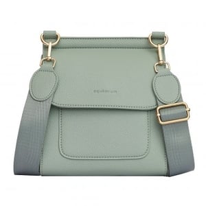 Introduce a touch of understated elegance to your collection with our stunning Cross Body Bag in Sage Green. This chic accessory, from the renowned 'equilibrium' brand, is designed for both style and practicality.
Crafted with a beautifully textured finish, this bag features a secure flap closure and a handy front pocket, perfect for keeping essentials close at hand. The wide, adjustable strap ensures comfortable wear, whether your customers prefer it over the shoulder or across the body. Complemented by elegant gold-tone hardware, this compact yet spacious bag is an absolute must-have. It's the ideal choice for everyday adventures or a stylish evening out. Available in single packs from Y and L Company Ltd., it's ready to become a best-seller in your store!
