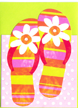 A pair of flip flops with daisies on them.