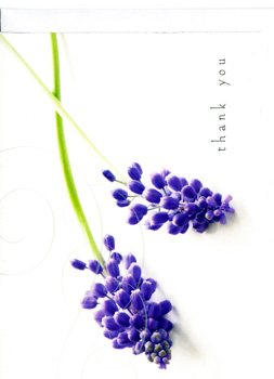 A thank-you card with purple flowers on a white background.