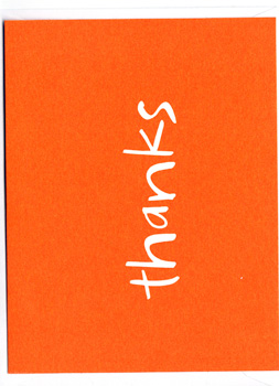 An orange square with the word "thanks" written on it.