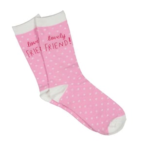 A pair of pink and white polka dot socks that say "love, lovely friend."