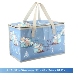 A blue bag with sailboats and houses on it.