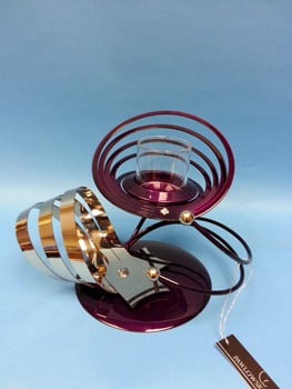 A purple and silver candle holder has a tag that says 'butterfly' on it.