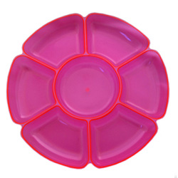 A pink flower-shaped tray with a red rim.