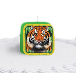 A square candle with a picture of a tiger on it.