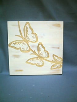 A painting of three butterflies on a branch.