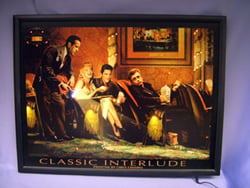 A framed picture of a classic interlude is lit up.