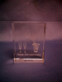 A glass block that says "Happy 40th Anniversary" on it.