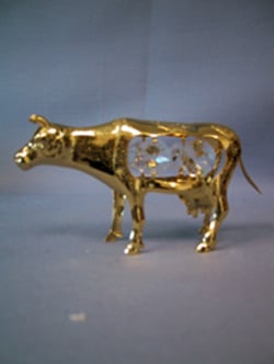 A golden cow with crystals inside it