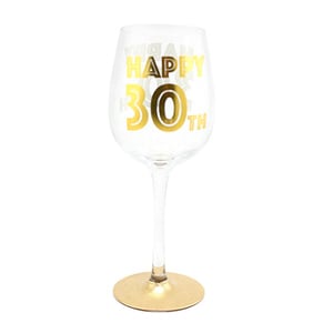 A wine glass that says "Happy 30th" on it.