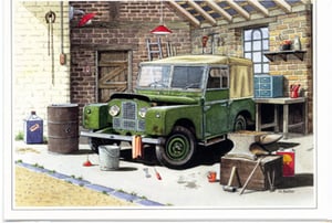 A painting of a green Land Rover is in a garage.