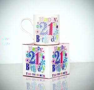 A mug that says "Happy 21st Birthday" on it.