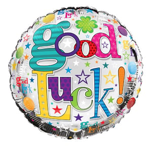 A balloon that says "good luck" on it.
