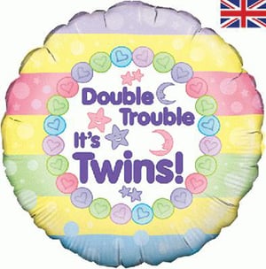 A balloon that says "double trouble, it's twins."