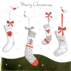 A Merry Christmas card with stockings hanging from a string.