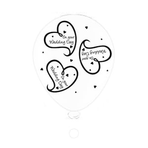 A balloon that says "on your wedding day" on it.
