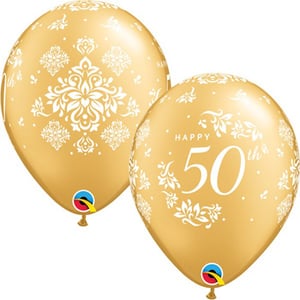 Two gold balloons that say "Happy 50th" on them.