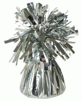 A silver balloon weight with tinsel on a white background.