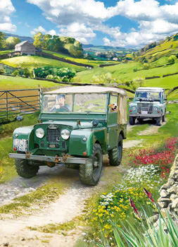 Two green Land Rovers is driving down a dirt road.