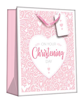A pink gift bag that says "on your christening day."