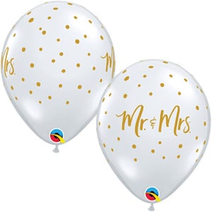 Two white balloons with gold polka dots that say "Mr." and "Mrs."