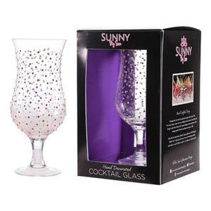 A sunny, hand-decorated cocktail glass in a box.