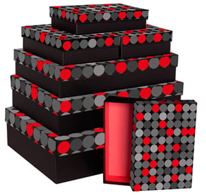 A stack of black boxes with red and gray polka dots on them.