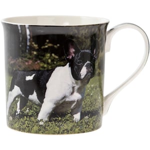 A black-and-white mug with a picture of a dog on it.
