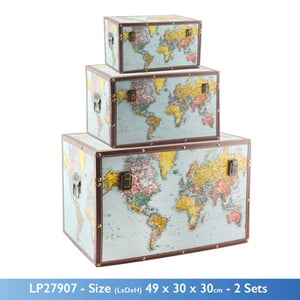 A set of three trunks with a world map on them.