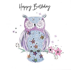 A birthday card with an owl and the words "happy birthday".